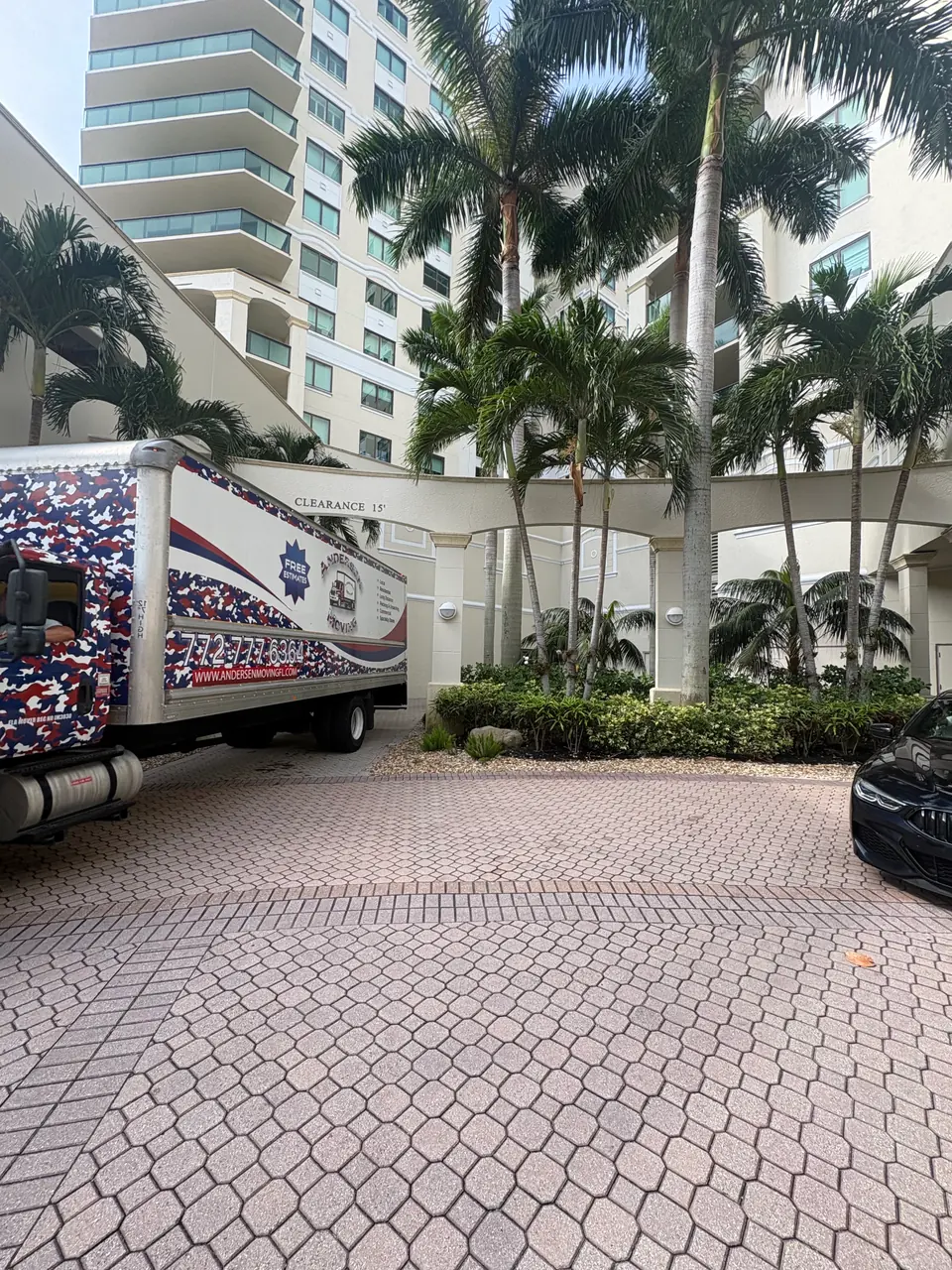 Andersen Moving truck at a Palm Beach Gardens high-rise condo entrance