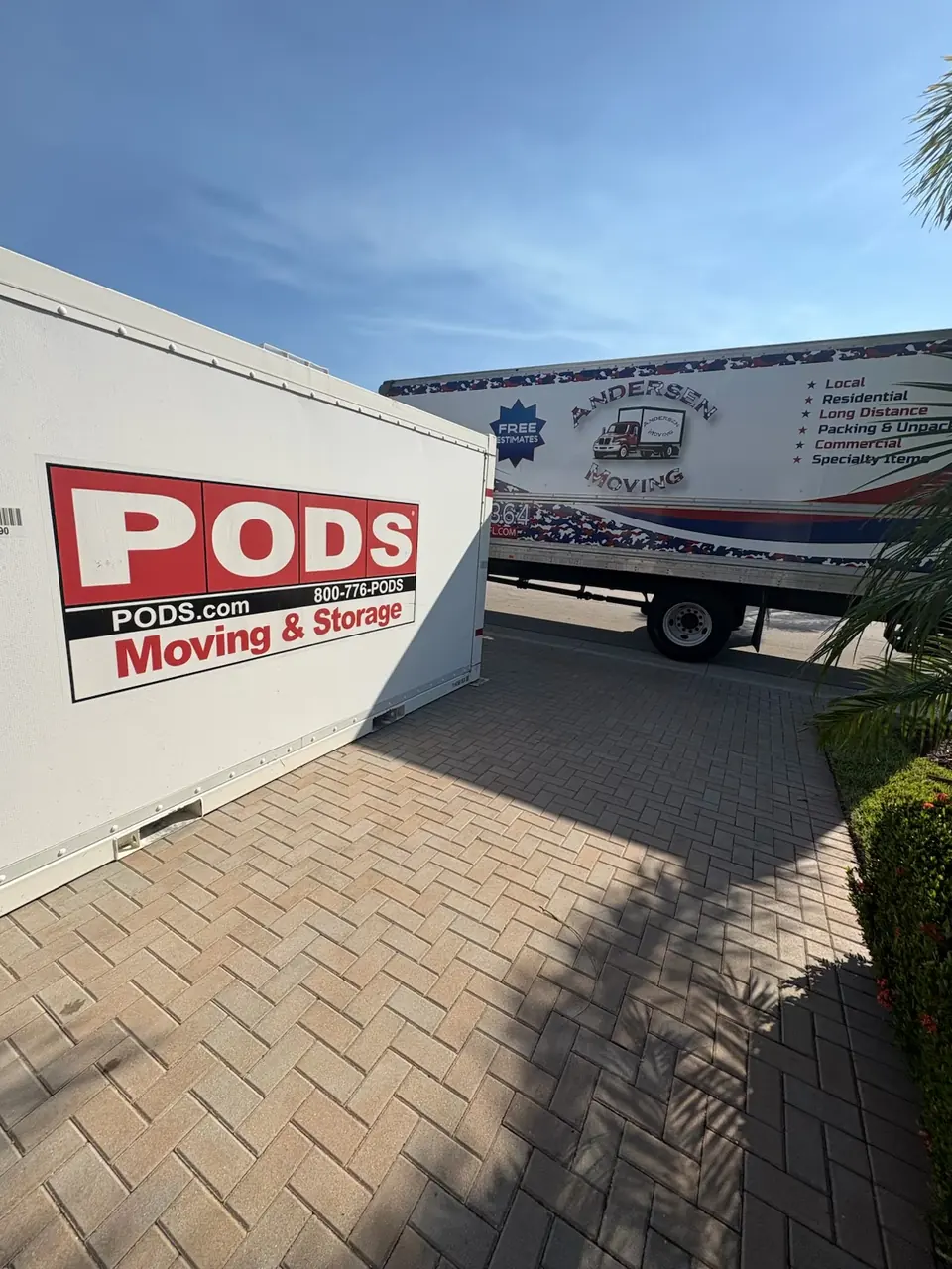 Andersen Moving truck and storage container in a Port St. Lucie driveway
